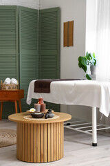 Interior of spa salon with couch and table