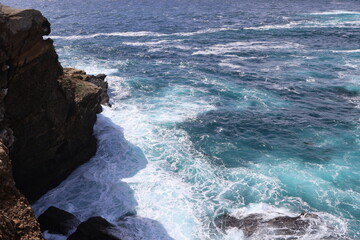 waves crashing on rocks
