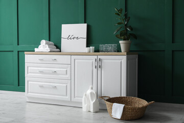 Interior of laundry room with wicker basket and counters