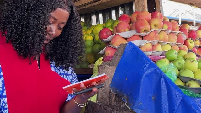 extreme close up video of black salesperson book recording business sales