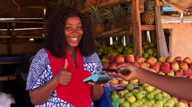 african market woman using nfc payment method
