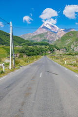 Straight asphalt road in Georgia in summer