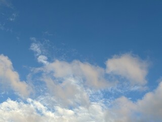 Dynamic composition of pure white clouds, textured against a bright blue sky, unique clouds,...