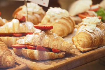 Fresh strawberry-filled croissants on display