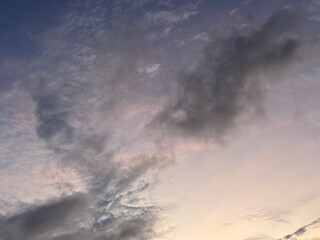 calm sky photo with soft and thin clouds golden light of the sun, light and shadow on the clouds create texture, bright blue sky calming background. Suitable for nature, tranquility, weather, freedom