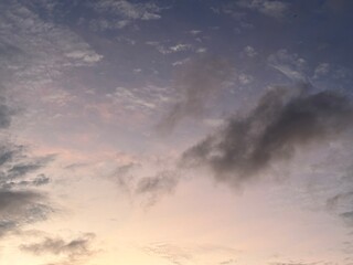 calm sky photo with soft and thin clouds golden light of the sun, light and shadow on the clouds create texture, bright blue sky calming background. Suitable for nature, tranquility, weather, freedom