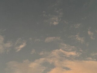 calm sky photo with soft and thin clouds golden light of the sun, light and shadow on the clouds create texture, bright blue sky calming background. Suitable for nature, tranquility, weather, freedom