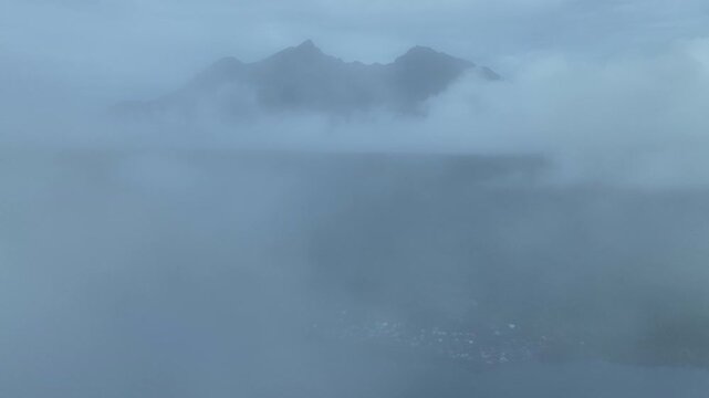 Low clouds encircle the volcanic island of Mokian just off the west coast of Halmahera in Indonesia. This tropical region is known for its spectacular biodiversity.