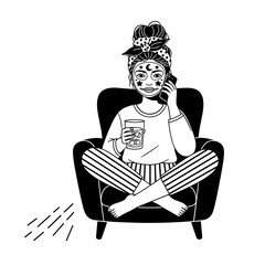 Woman in Pajamas Relaxing in Armchair with Face Mask and Drink