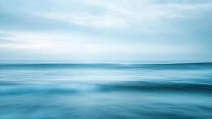 Obraz premium A Tranquil Ocean Scene with a Minimalist Aesthetic in Soft Blue Hues