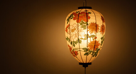 Obraz premium Traditional Chinese Floral Paper Lantern Illuminated with Warm Light on Dark Background