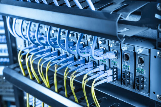 server with fiber optic cables  and network cable in data center