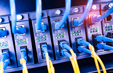 server with fiber optic cables  and network cable in data center