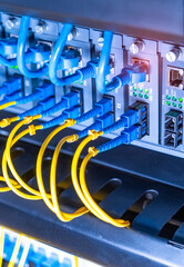 server with fiber optic cables  and network cable in data center