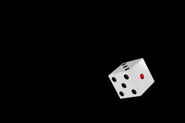 黒背景に転がる白のサイコロ
