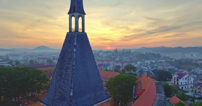 Aerial view of Da Lat Pedagogy college with ancient French architecture in mist sunrise, Da Lat city, central Vietnam