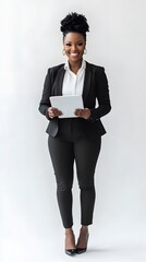 Confident woman in a black business suit holds a tablet.