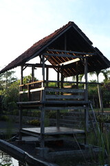 wooden huts in the rice fields in rural Indonesia
