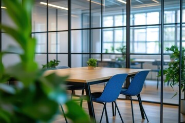 Modern office meeting room with glass partition, light wood table, blue chairs, and potted plants