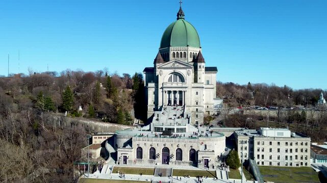4K drone footage of Montreal, Canada. Aerial view of the downtown skyline, historic buildings, St. Lawrence River, and iconic landmarks during golden hour light.