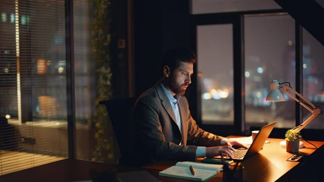 Evening manager working computer reacting fail at lamp light workplace closeup