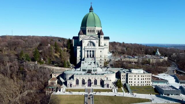 4K drone footage of Montreal, Canada. Aerial view of the downtown skyline, historic buildings, St. Lawrence River, and iconic landmarks during golden hour light.