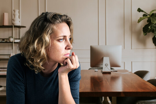 Stress woman sitting thoughtfully alone