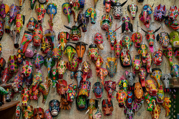 Colorful wooden masks wall in Guatemala market