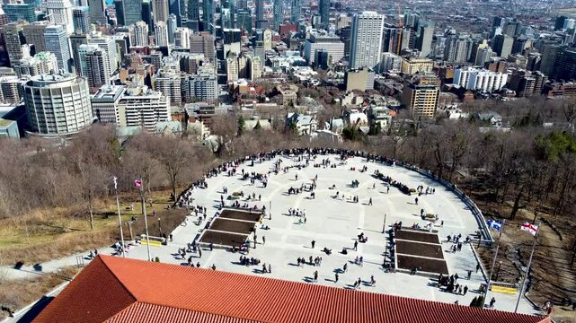 4K drone footage of Montreal, Canada. Aerial view of the downtown skyline, historic buildings, St. Lawrence River, and iconic landmarks during golden hour light.