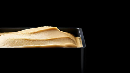 Closeup Of Caramel Ice Cream In Black Container