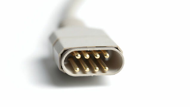 The Toolverse Cable connector with gold-plated pins, macro view, isolated on white, side angle showing detailed threading and shielding (4)