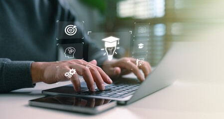 Fototapeta na wymiar Online education and digital learning concept. Hands typing on a laptop with education icons such as diploma, brain, and target, ideal for e-learning platforms, digital skill development.