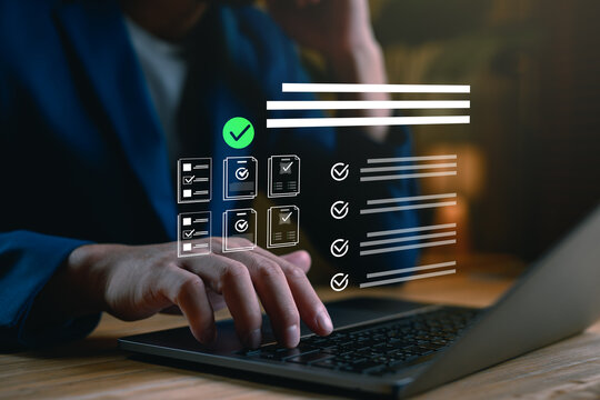Digital checklist and task management concept. Businessperson using a laptop with virtual checklist icons, ideal for workflow planning, project tracking, productivity tools, time management systems.