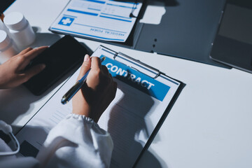Male and female doctors are having a meeting in a hospital room.