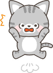 驚いて跳び上がるネコ