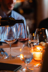pouring-red-wine-into-glass-in-elegant-restaurant