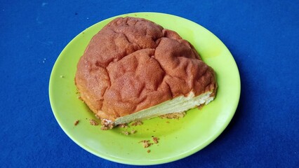 Slice of Cheesecake on Green Plate
