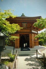 Wooden Temple Surrounded by Greenery in Japan