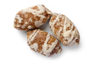Three gingerbread on a white background with a shadow. Close-up of sweet glazed gingerbread.