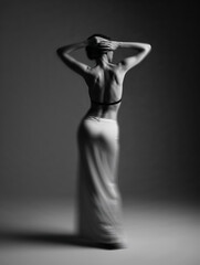 woman in black dress, woman in black dress. young man with his back pain in his back, young man with a naked torso