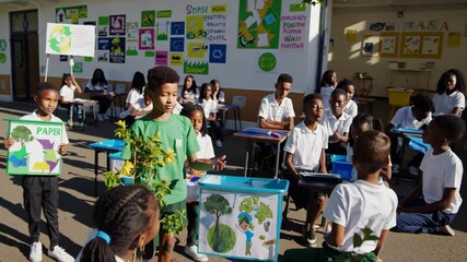 Schoolchildren planting trees and learning about recycling - Powered by Adobe