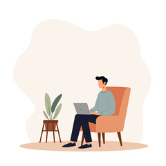 A young man creative worker is working with laptop sitting on a couch