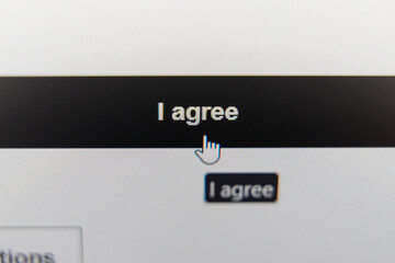 Close-up of a computer screen showing a cursor clicking on an I agree button for terms and...