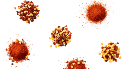 Overhead View of Various Piles of Crushed Red Pepper Flakes and Chili Powder on a Black Background