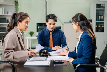 Business and lawyers discussing contract papers with brass scale on desk in office. Law, legal services, advice, justice and law