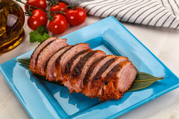 Sliced duck breast baked with cherry