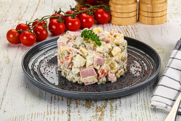 Russian traditional Olivier salad with sausages