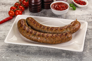 Grilled beef sausages with sauce