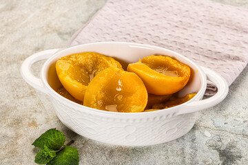 Canned marinated peach in syrop