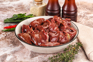 Raw uncokked chicken liver in the bowl